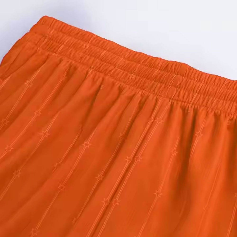 Plain blank orange basketball uniform with matching jersey and shorts